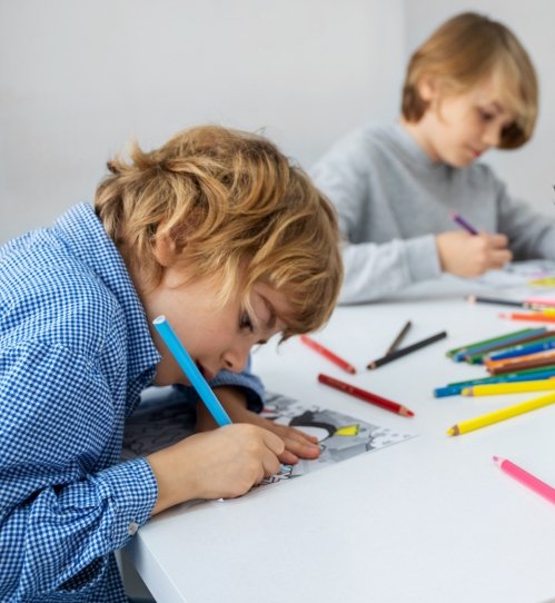 Children at a table coloring